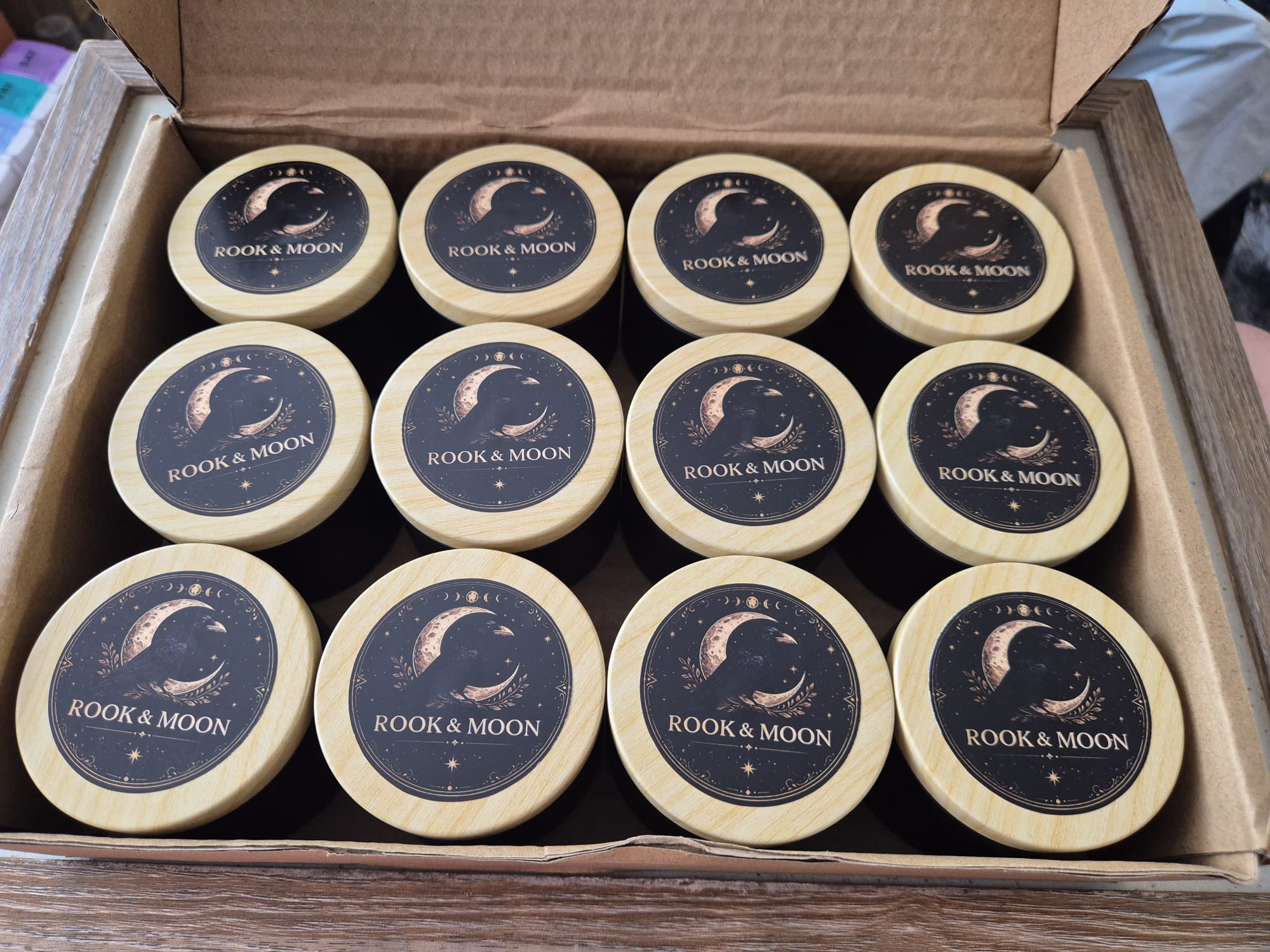 Hand-poured candles in branded tins